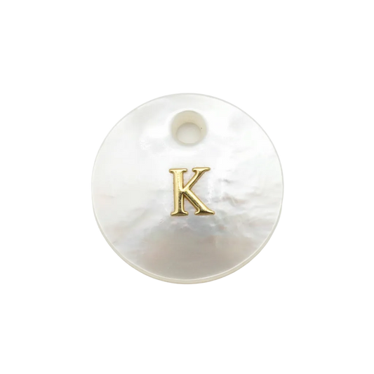 Iridescent mother-of-pearl disc with raised gold letter K