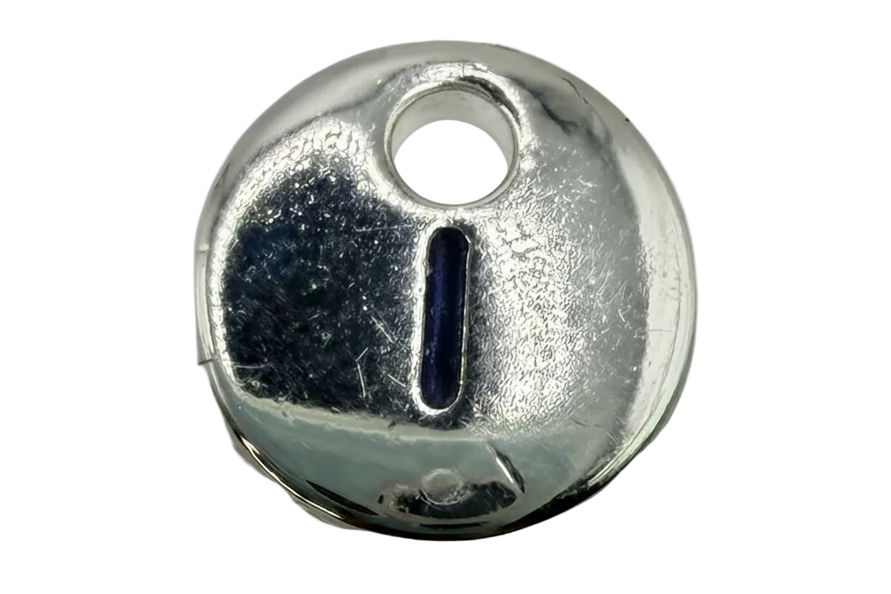 Round silver keyhole disk charm with polished finish and raised keyhole detail
