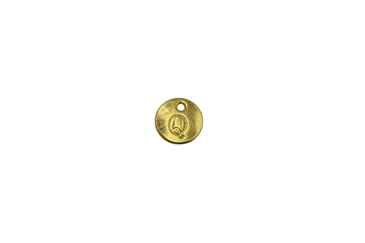 Gold engraved Q initial disk