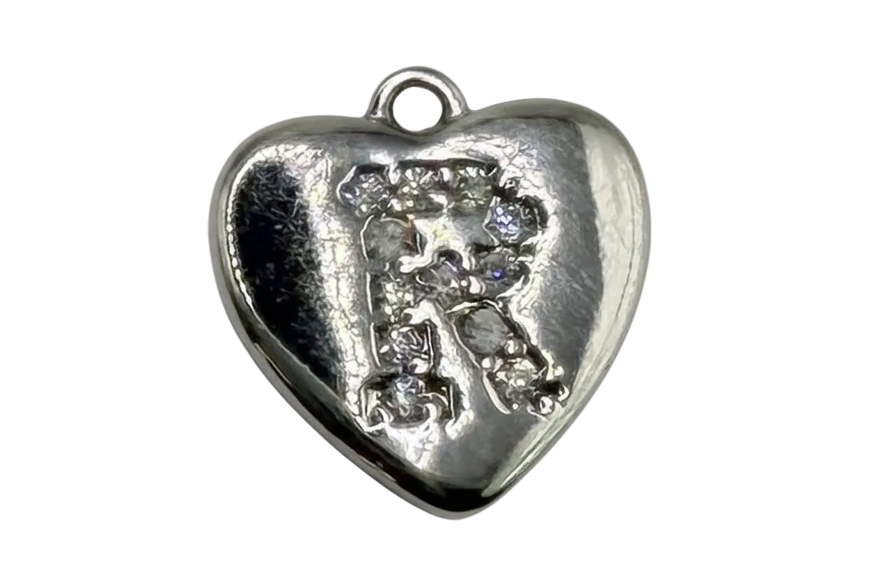 Polished silver heart with raised pavé letter R and clear crystal accents