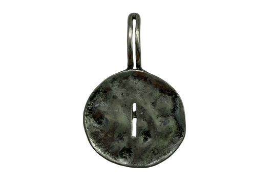 Antiqued silver round token with a central slit and mottled patina finish
