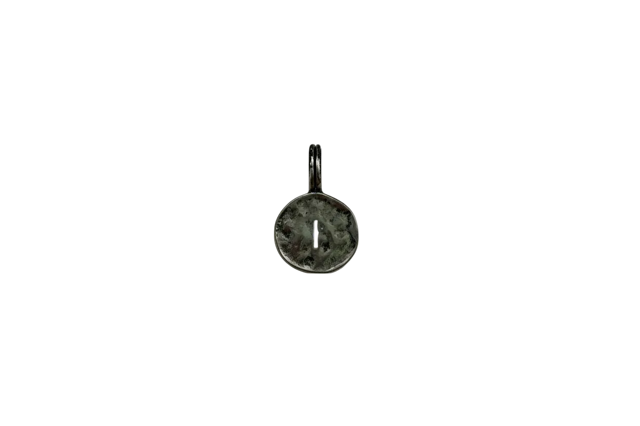 Antiqued silver slotted round token with patina