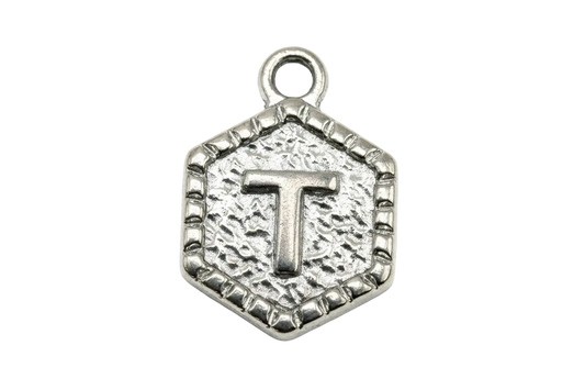 Antiqued silver hexagon medallion with raised letter T and beaded border