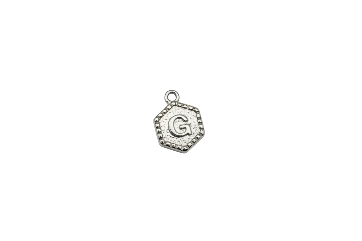 Silver square tile with raised letter G