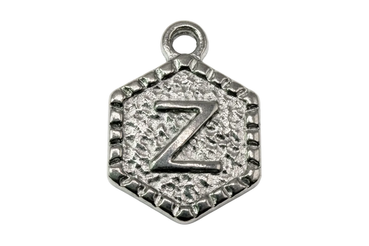 Antiqued silver hexagon medallion with raised letter Z and textured background