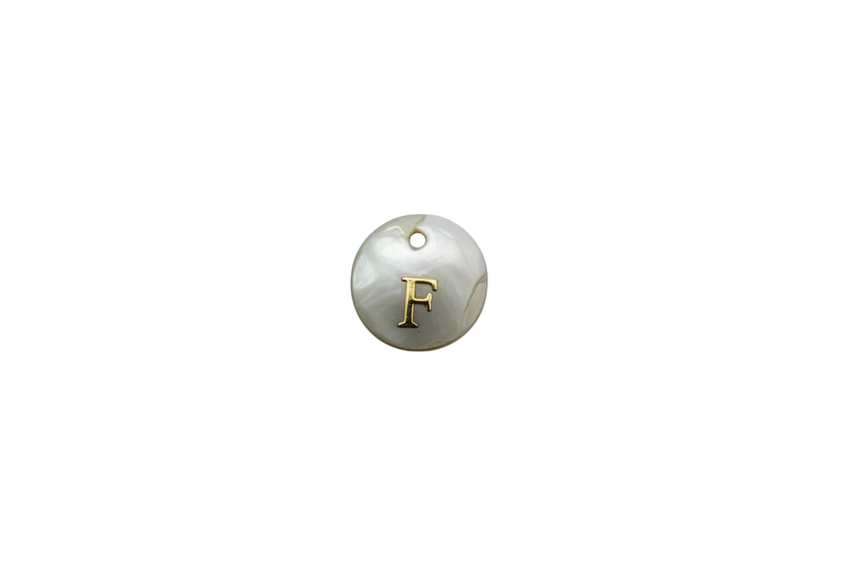 White round medallion with gold letter F