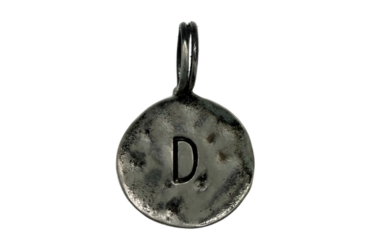 Antiqued silver round coin with stamped letter D