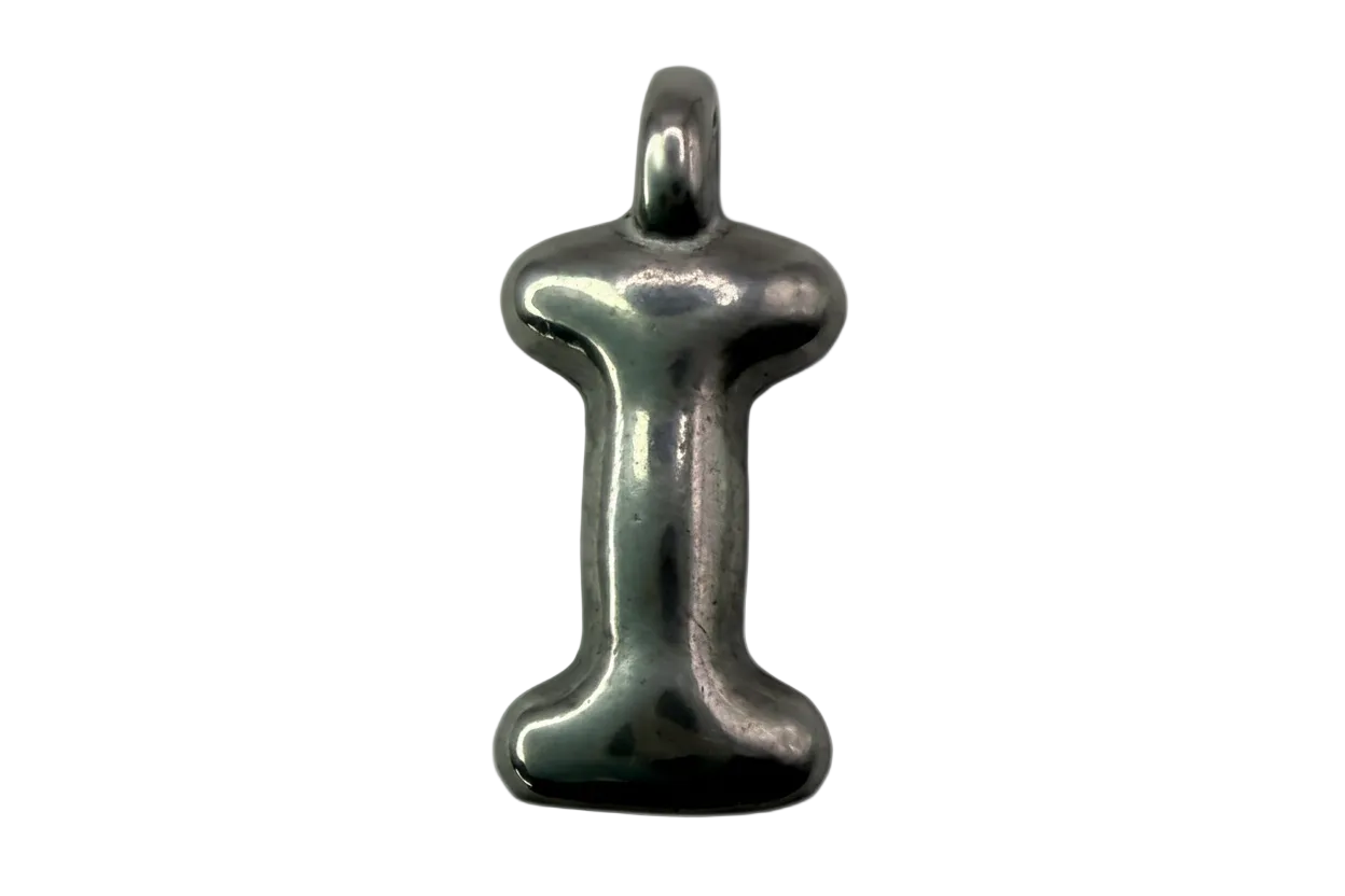 Polished silver initial charm shaped like the letter I with a smooth rounded profile