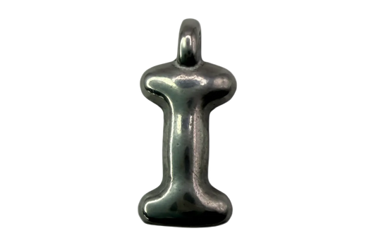 Polished silver initial charm shaped like the letter I with a smooth rounded profile