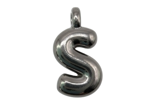 Polished silver letter S charm with rounded, sculpted shape on black background