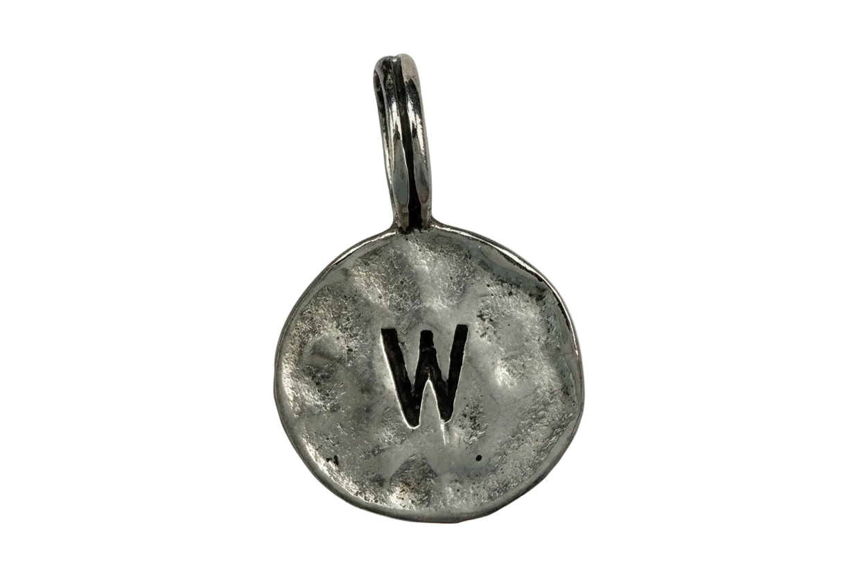 Antiqued silver-tone round coin with black letter W initial
