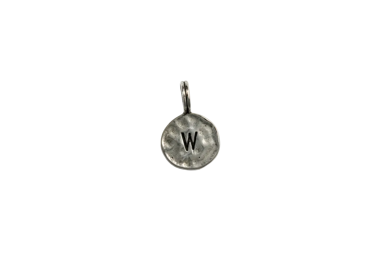 Silver-tone coin with black W initial