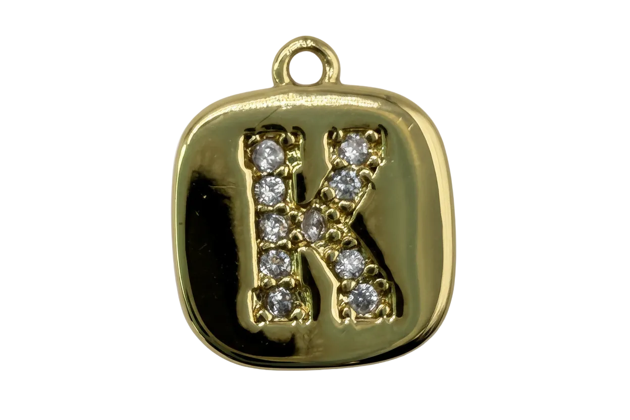 Gold rounded-square tile with pavé initial K in clear gems