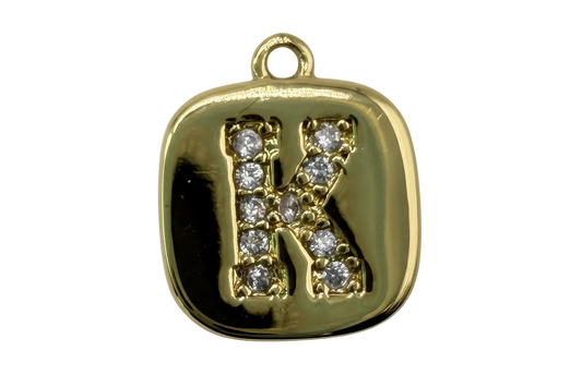 Gold rounded-square tile with pavé initial K in clear gems