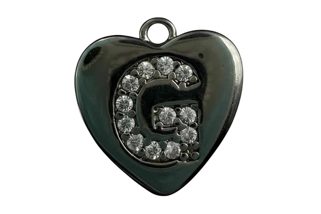 Polished silver heart with pavé letter G in clear crystals