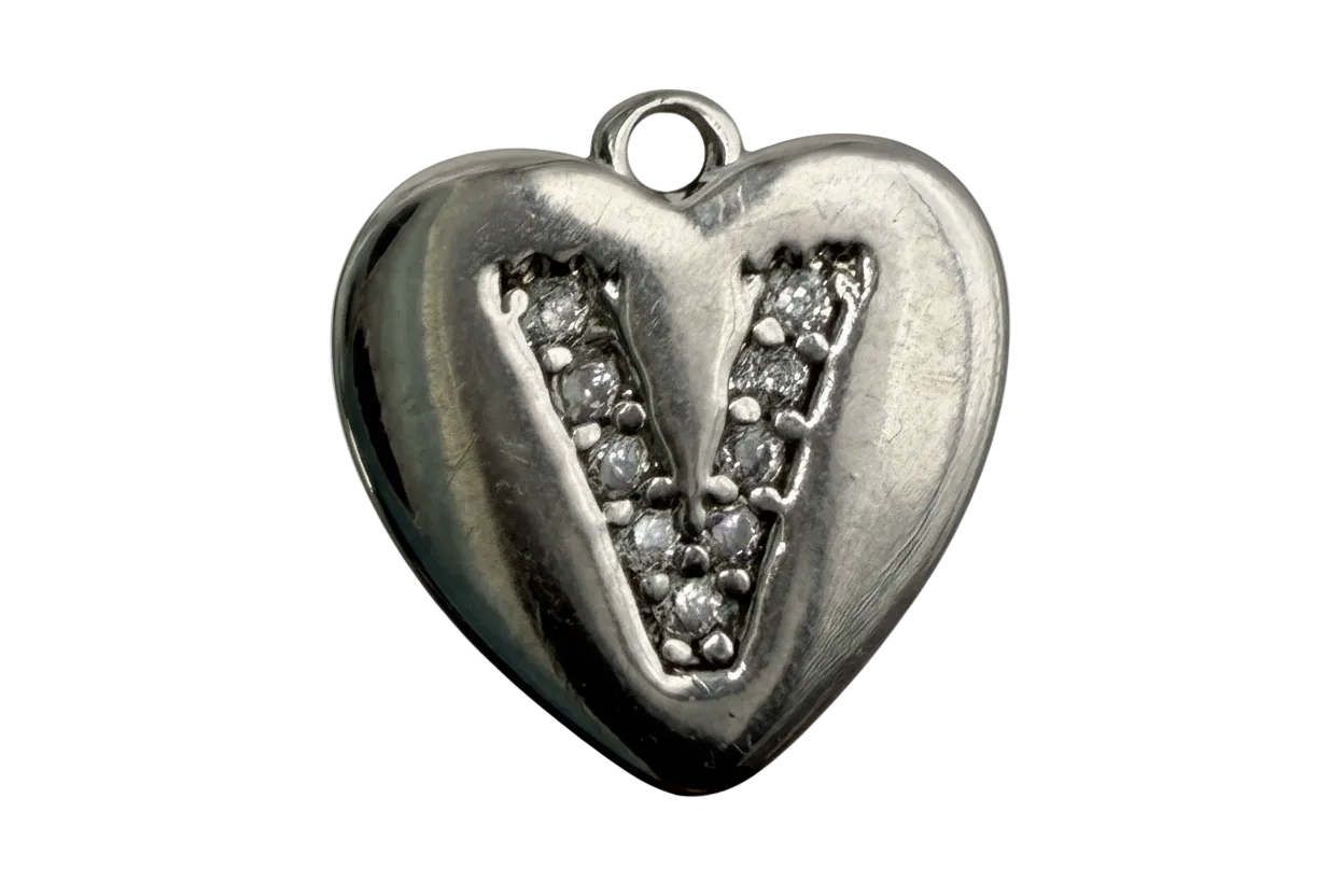 Polished silver heart with pavé letter V inset of clear stones