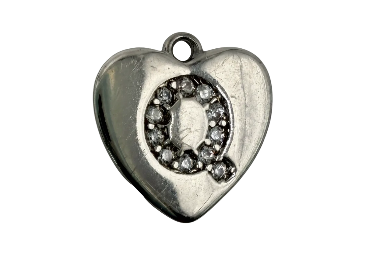 Polished silver-tone puffy heart with pavé letter Q in clear crystals