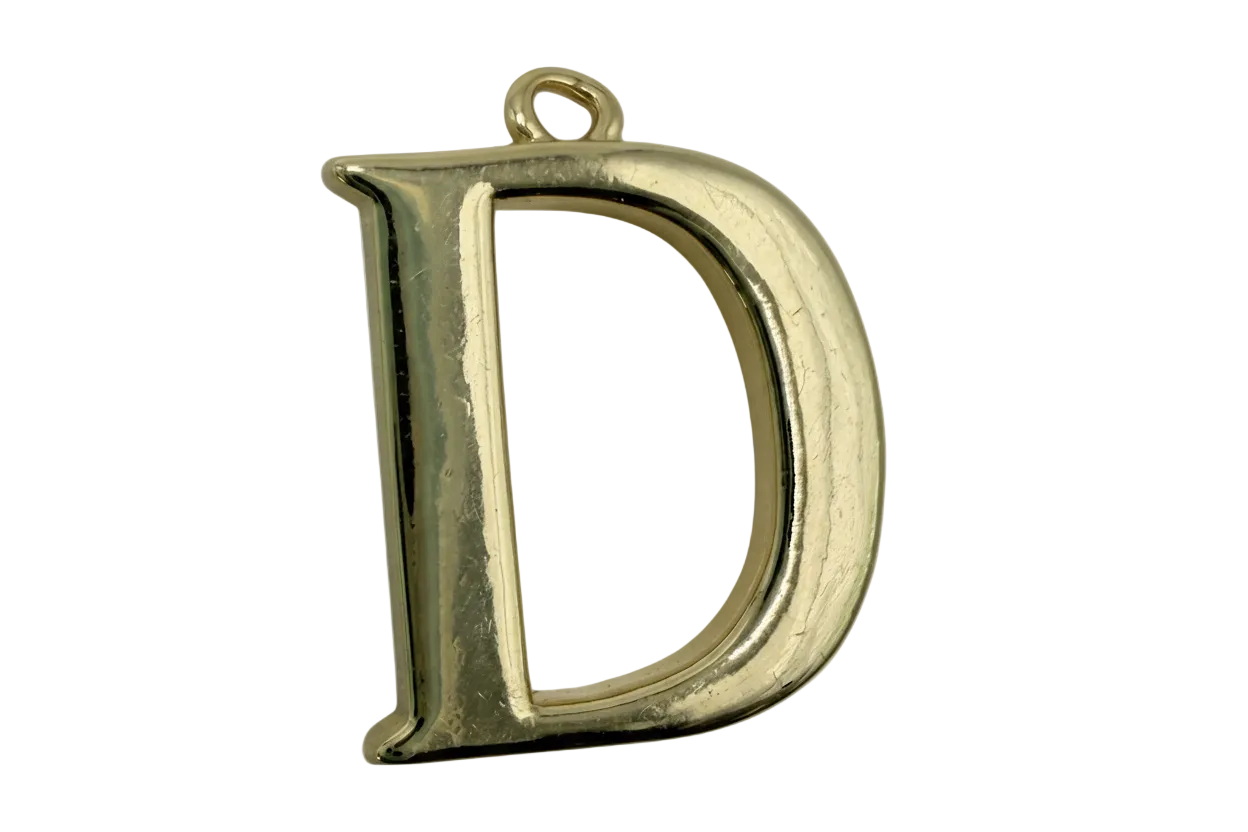 Polished gold letter D initial in a bold block serif style with smooth, rounded edges
