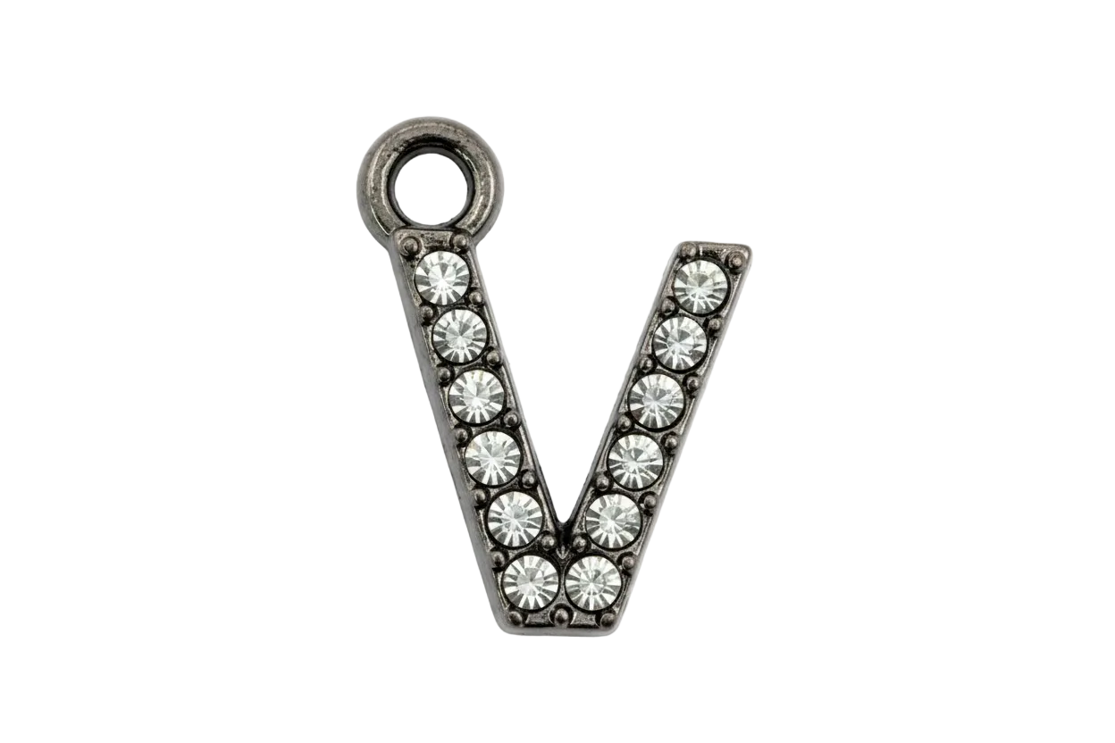 Silver letter V charm with clear crystal pavé detailing on a black background
