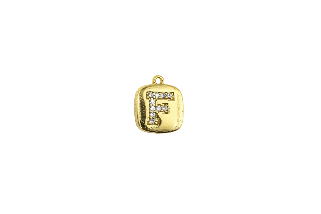 Gold rounded-square tile with pavé letter F in clear stones