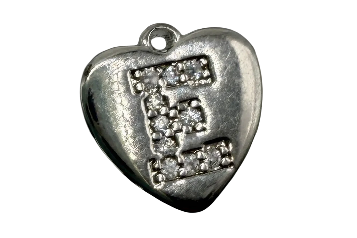 Polished silver heart with pavé initial E in clear stones