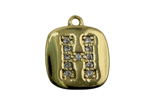 Gold rounded-square tile with pavé letter H in clear crystals