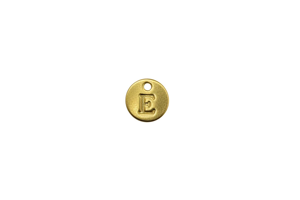 Gold round coin with raised letter E