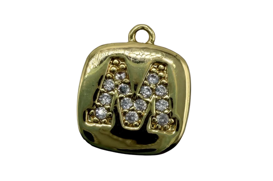 Glossy gold rounded square initial tile with raised pavé letter M set with clear gems