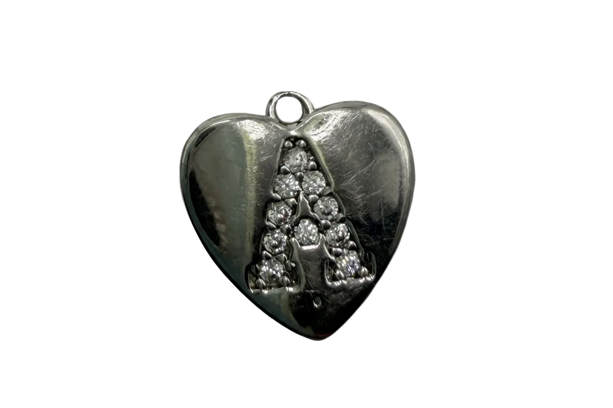 Polished silver heart charm with triangular cluster of clear crystals