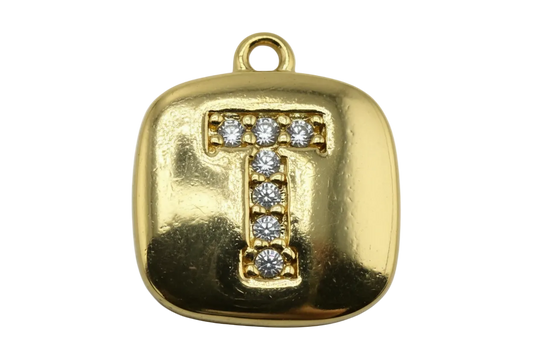 Rounded square gold tag with pavé initial T set with clear gemstones