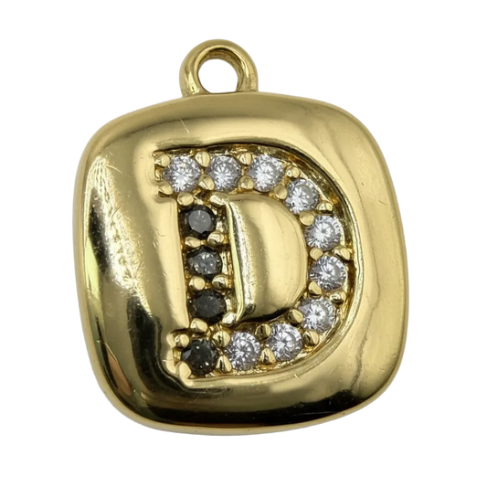 Gold letter D tile with clear pavé stones and polished finish