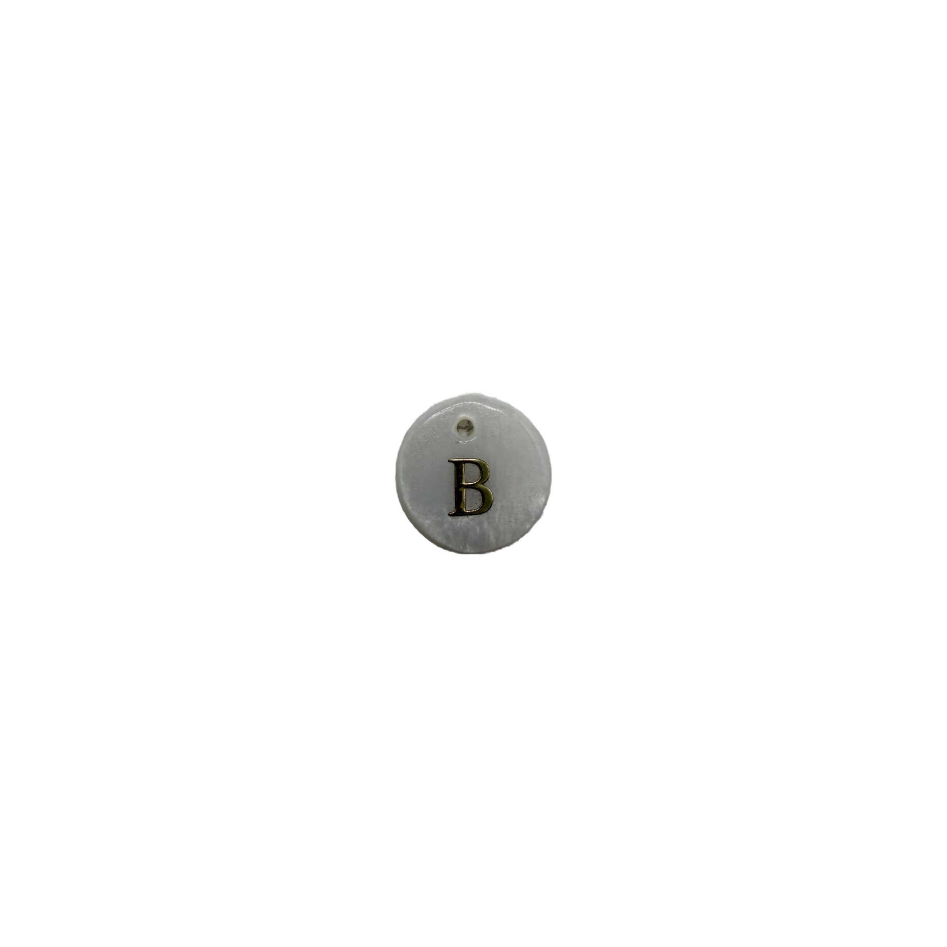 White round disc with gold letter B