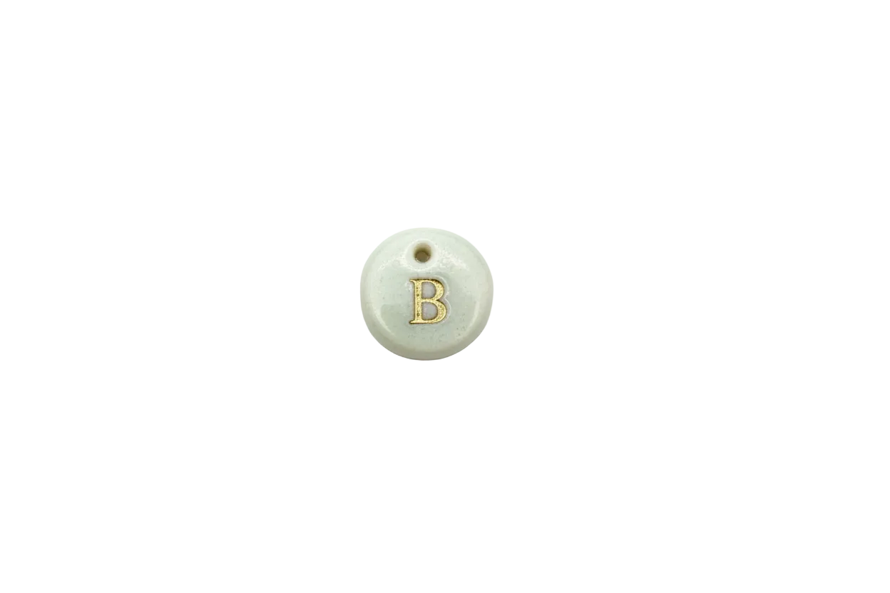 Marbled white disc with gold letter B