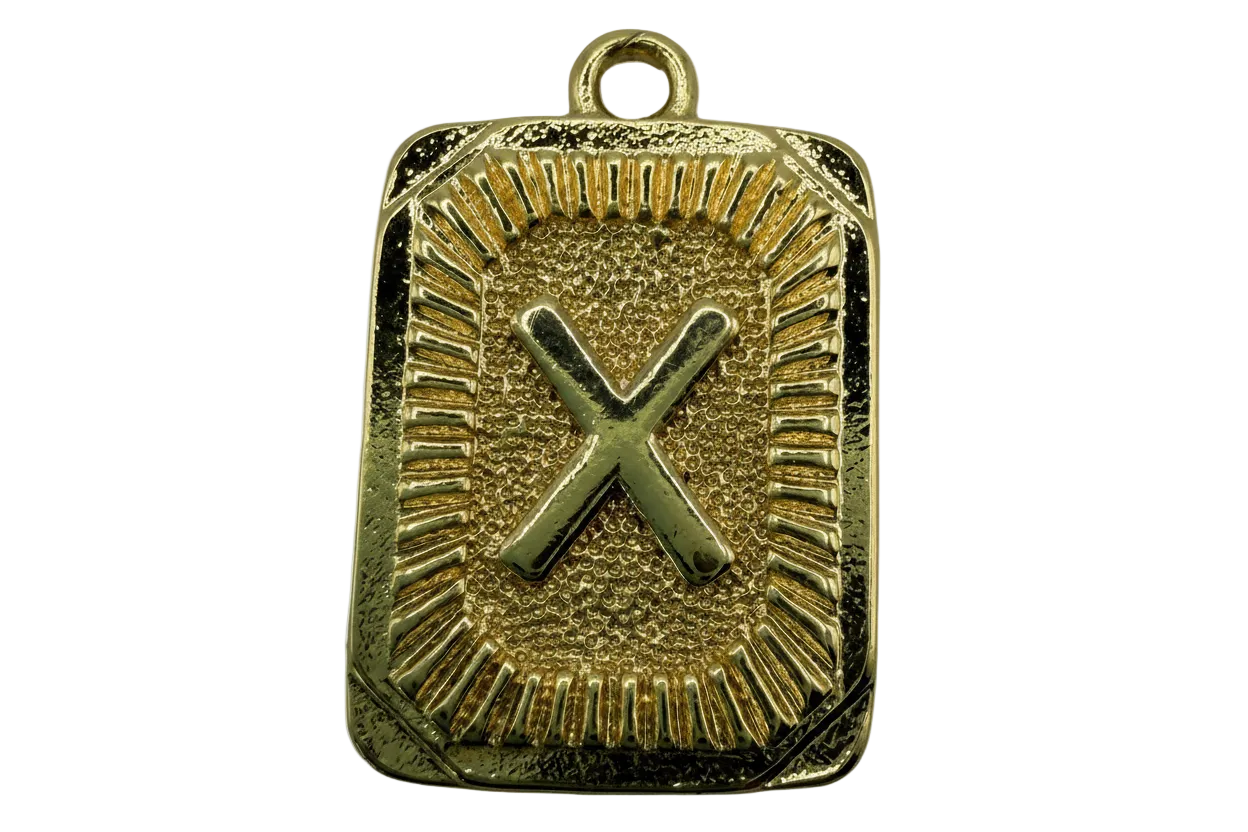 Gold rectangular plaque with raised letter X and textured radiating border