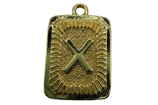 Gold rectangular plaque with raised letter X and textured radiating border