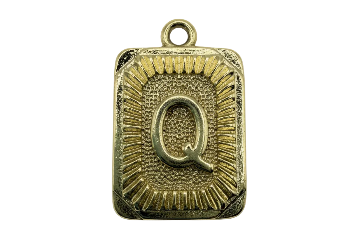 Gold rectangular initial plaque with raised letter Q and sunburst textured border