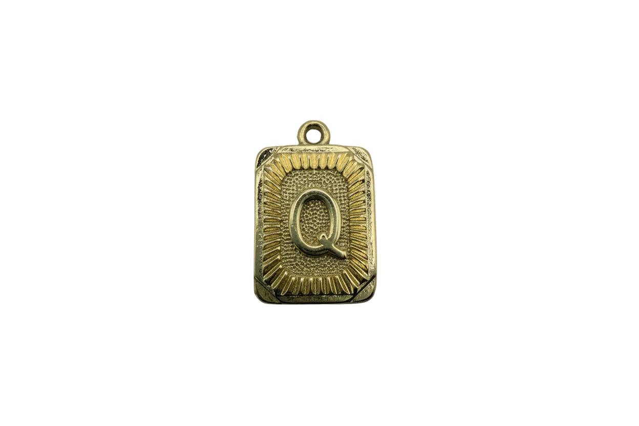 Gold letter Q plaque with sunburst texture