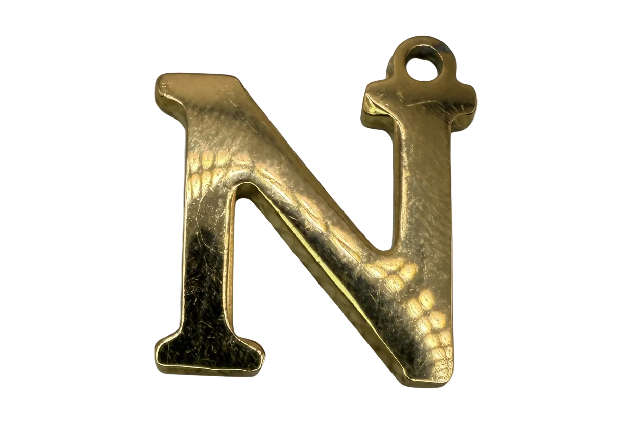 Polished gold initial N letter with smooth, reflective finish