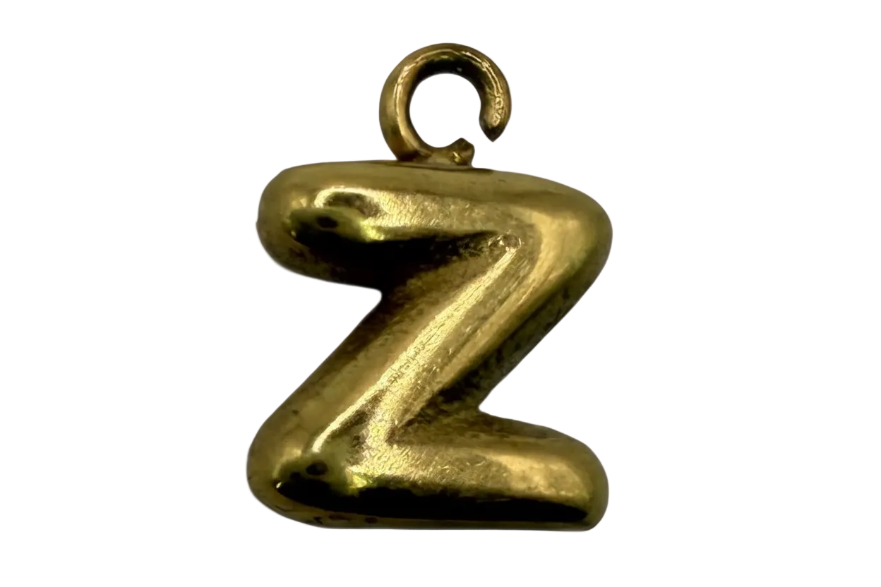 Polished gold letter Z initial with rounded, puffy silhouette