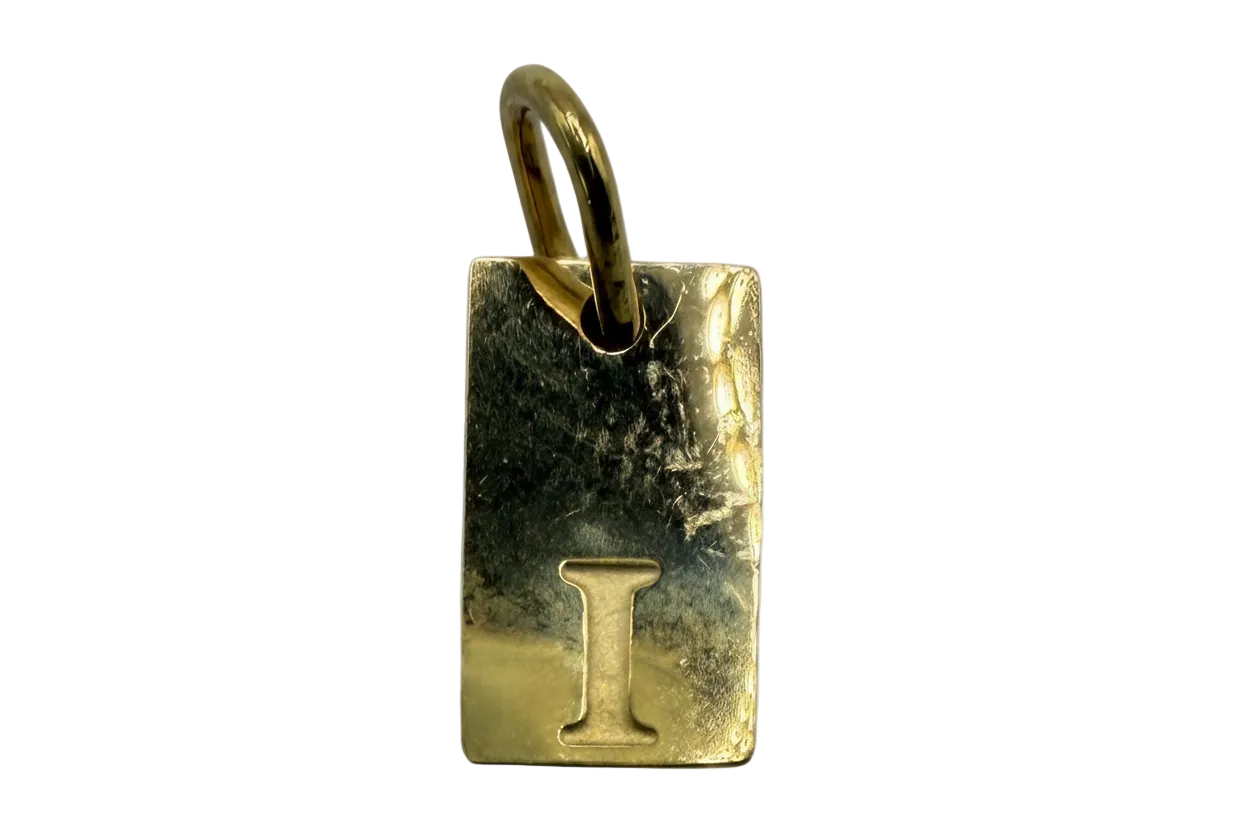 Gold rectangular initial tag with embossed letter I