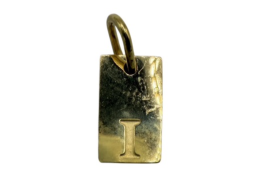 Gold rectangular initial tag with embossed letter I