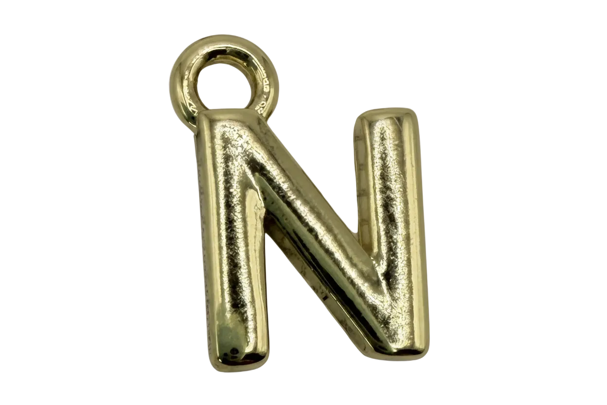 Polished gold letter N charm with rounded, puffed silhouette