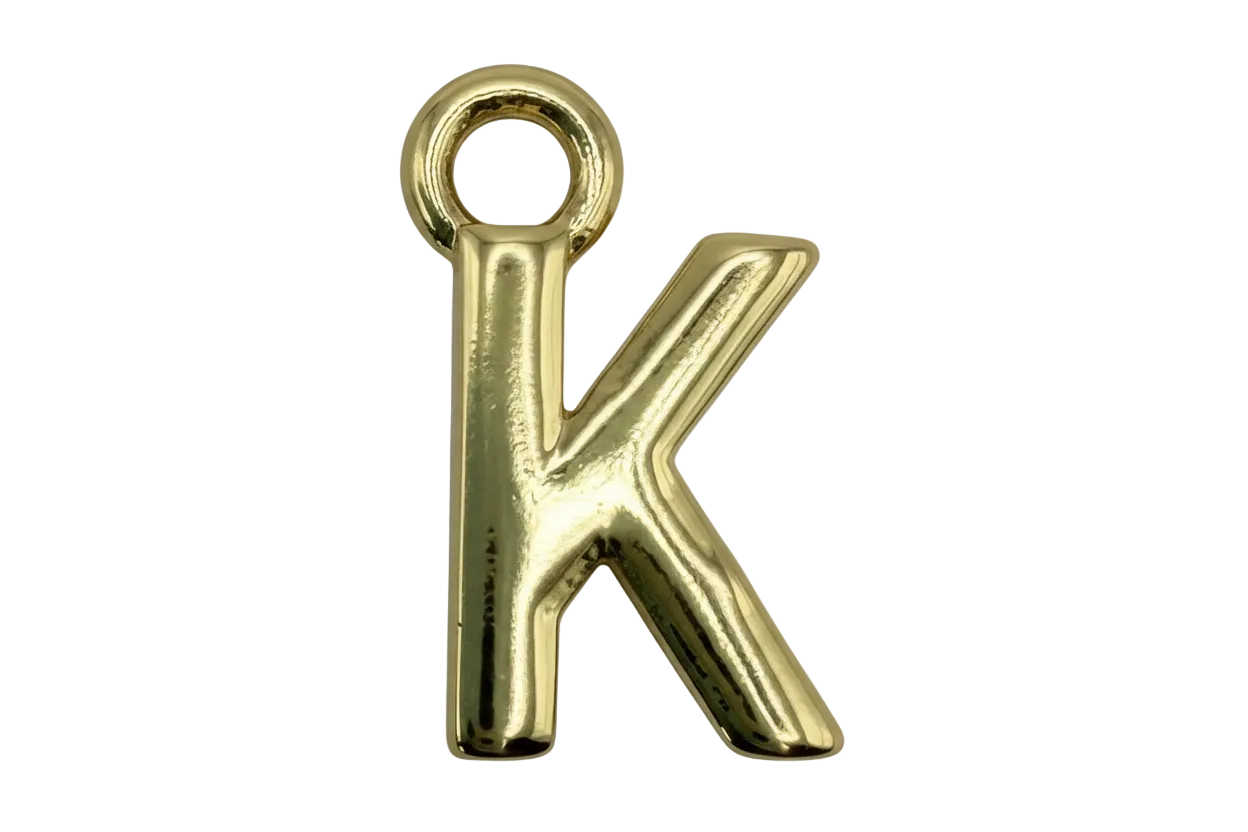 Polished gold letter K charm with a smooth reflective finish