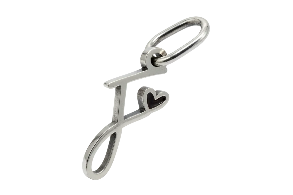 Polished silver letter F initial with a small heart detail