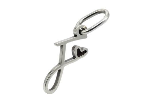 Polished silver letter F initial with a small heart detail