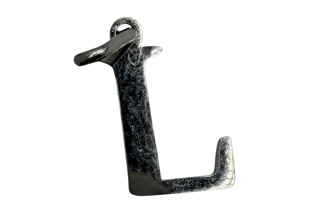 Polished silver letter L initial with a subtly textured finish