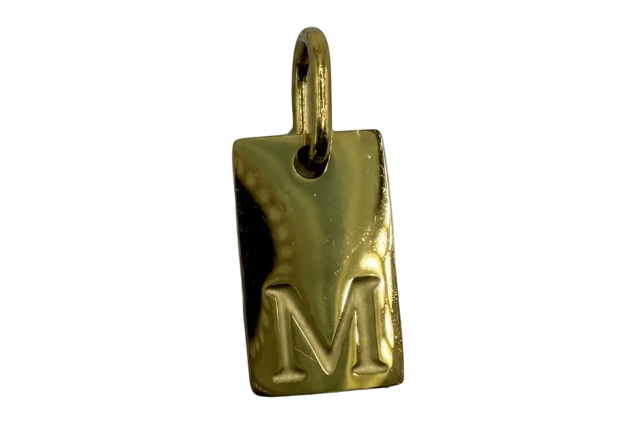 Polished gold rectangular tag with raised letter M