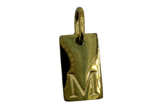 Polished gold rectangular tag with raised letter M