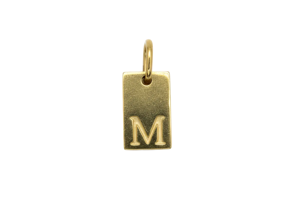 Gold rectangular initial tag with raised letter M