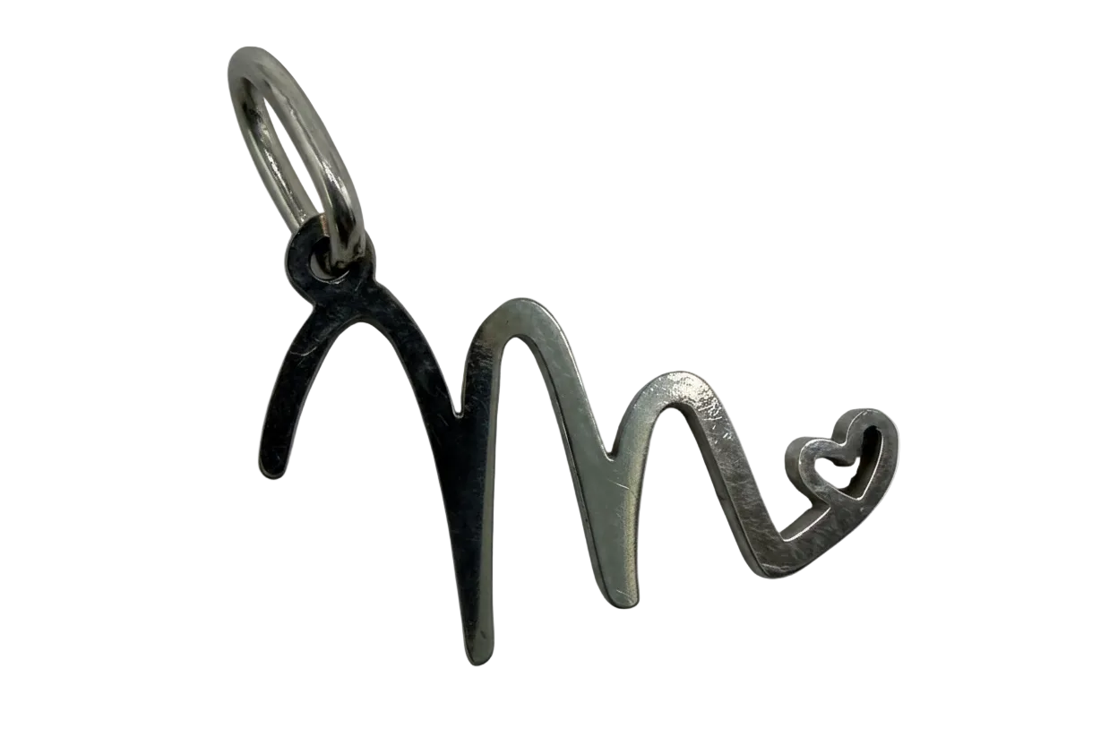 Polished silver script M initial charm with small open heart detail